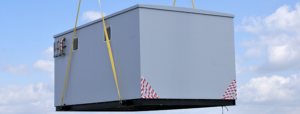 GRP plant room being lifted into position for hot water provision