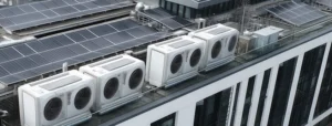 pv array and heat pumps on the roof of a commercial build;ing